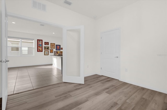 empty room with light hardwood / wood-style floors