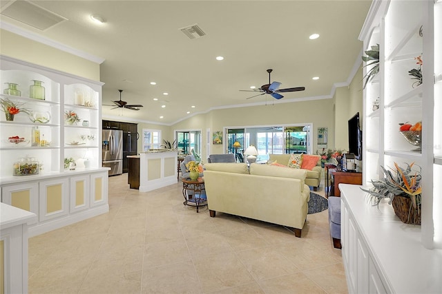 tiled living room with ceiling fan, lofted ceiling, and ornamental molding