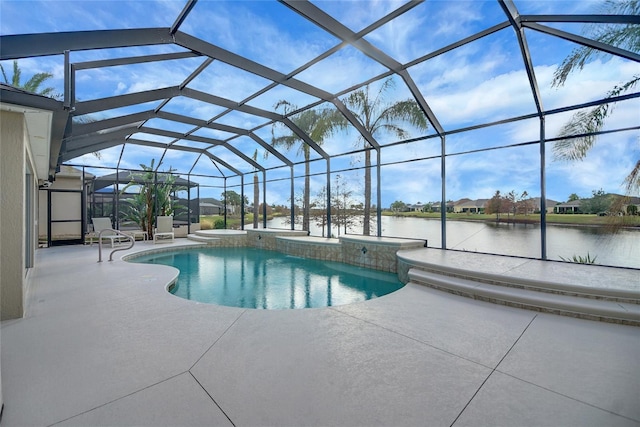 view of swimming pool with glass enclosure, a patio area, and a water view