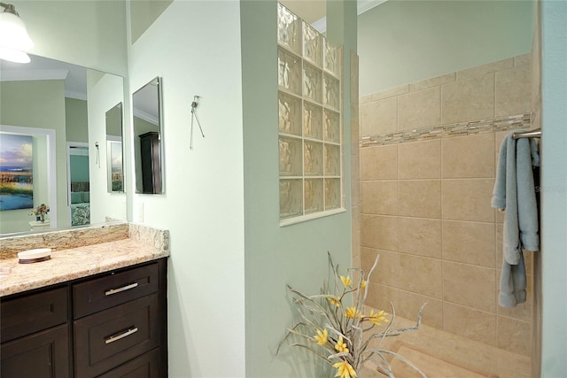 bathroom with vanity and crown molding