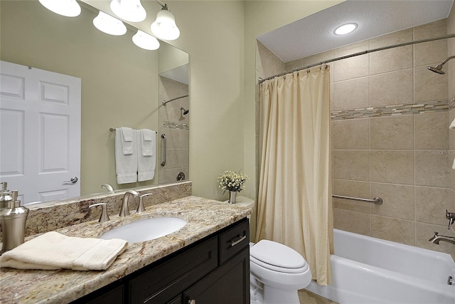 full bathroom featuring shower / tub combo, vanity, and toilet