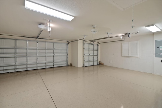 garage featuring electric panel and a garage door opener