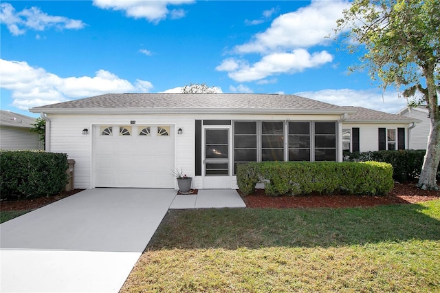 ranch-style house with a garage and a front yard