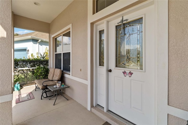 property entrance featuring a porch