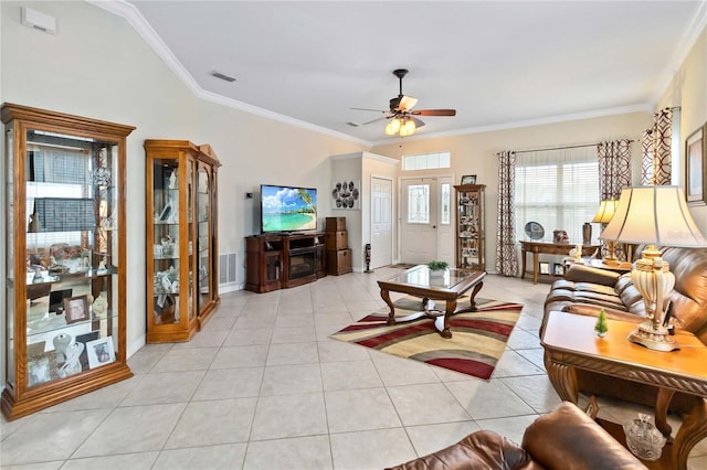 living room with crown molding, ceiling fan, and light tile patterned floors