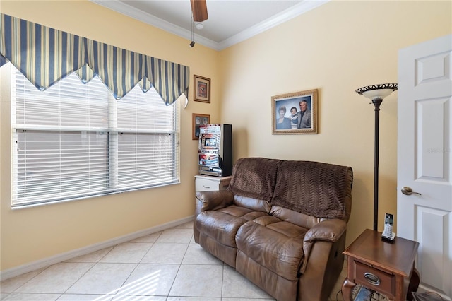 living area with ceiling fan, light tile patterned floors, and ornamental molding