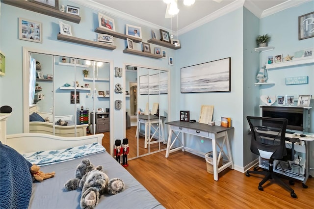 bedroom with hardwood / wood-style flooring and ornamental molding