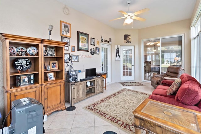 living room featuring ceiling fan, a healthy amount of sunlight, and light tile patterned floors