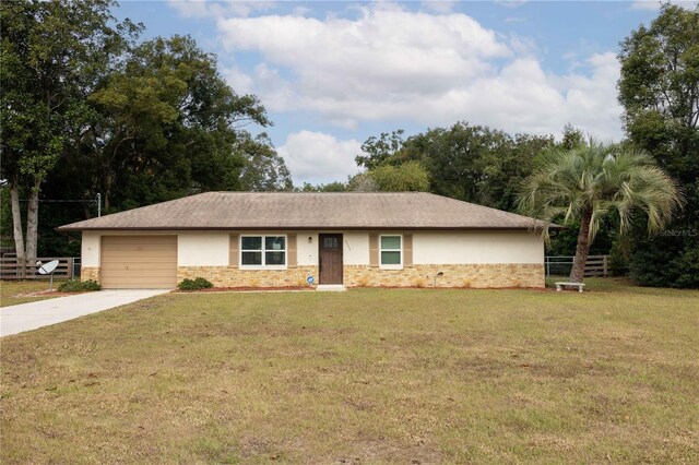 ranch-style home with a front lawn and a garage