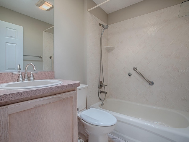 full bathroom featuring vanity, toilet, and tiled shower / bath combo