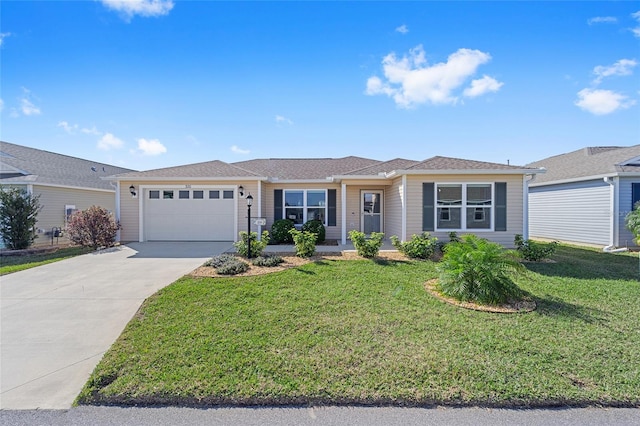 ranch-style house featuring concrete driveway, an attached garage, and a front yard