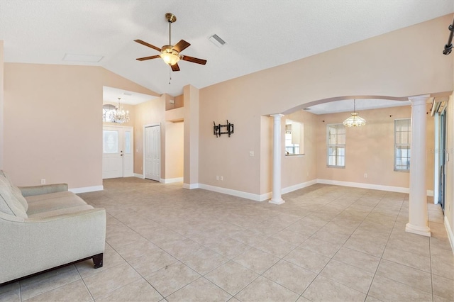 living room featuring ceiling fan with notable chandelier, ornate columns, lofted ceiling, and light tile patterned flooring