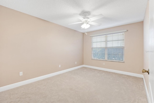 unfurnished room with light carpet, a textured ceiling, and ceiling fan