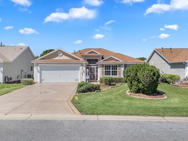 single story home with a garage and a front yard