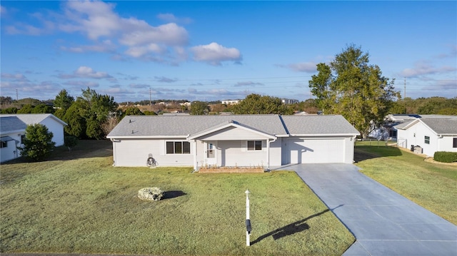 ranch-style house featuring a front yard and a garage