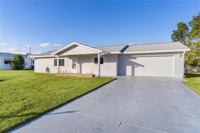 ranch-style home with a garage and a front lawn