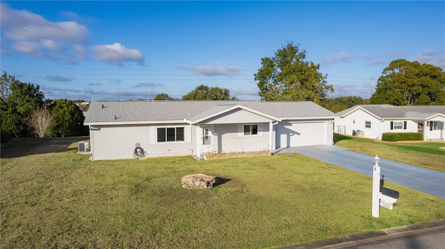 ranch-style house featuring a garage and a front yard