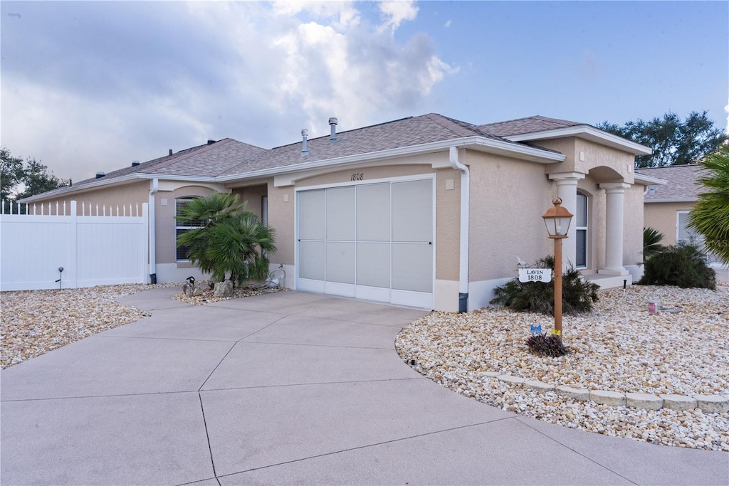 ranch-style home featuring a garage