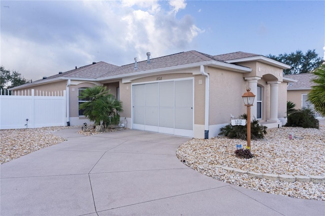 ranch-style home featuring a garage