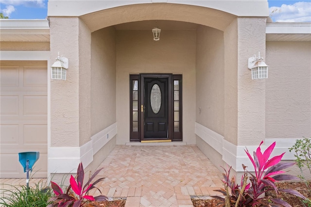 doorway to property featuring a garage