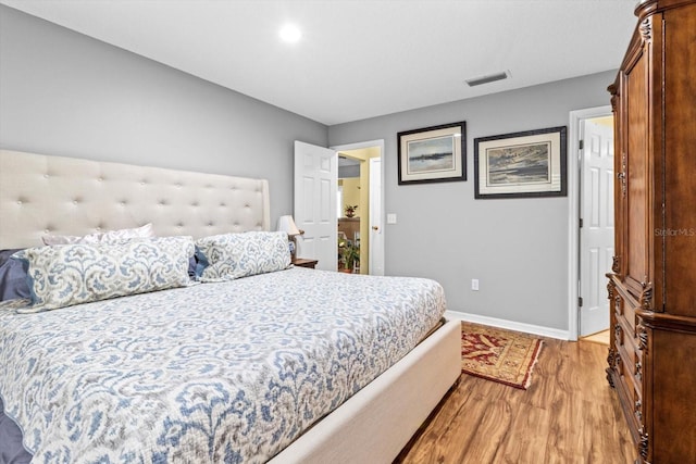 bedroom featuring light hardwood / wood-style flooring