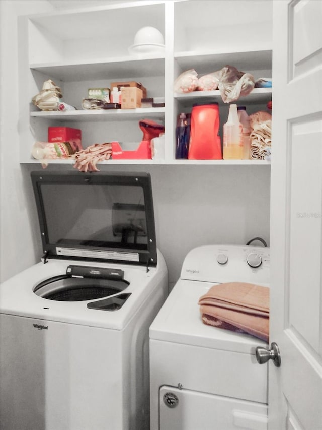 washroom featuring washer and clothes dryer