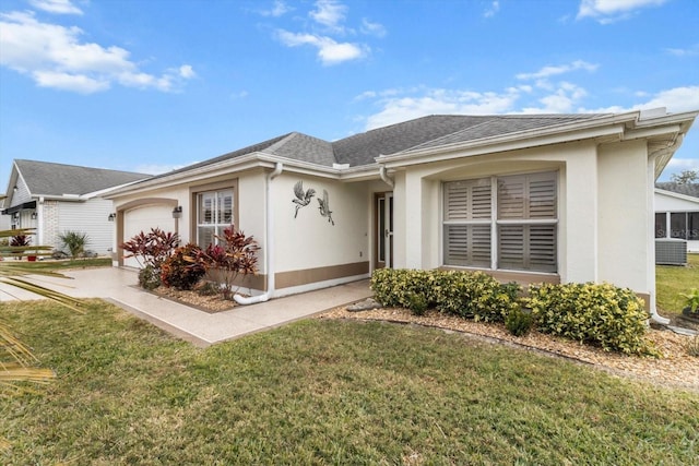 ranch-style house with a front lawn, a garage, and cooling unit