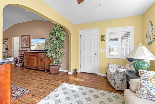 603 San Pedro Dr, The Villages, FL 32159 - foyer featuring wood finished floors, arched walkways, and baseboards