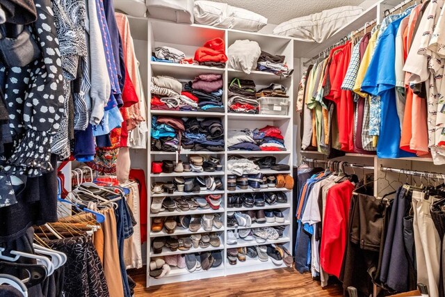 603 San Pedro Dr, The Villages, FL 32159 - walk in closet with wood finished floors