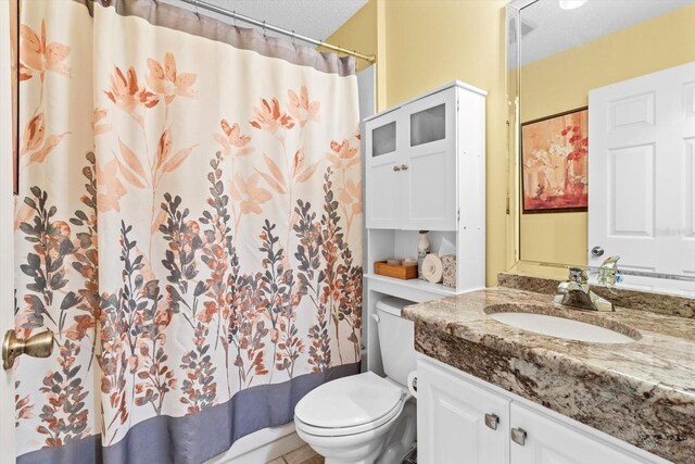 603 San Pedro Dr, The Villages, FL 32159 - bathroom featuring toilet, vanity, a textured ceiling, and a shower with shower curtain