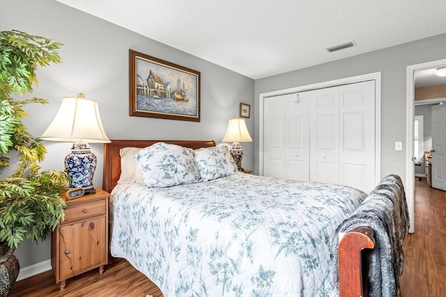 603 San Pedro Dr, The Villages, FL 32159 - bedroom featuring wood finished floors, a closet, and baseboards