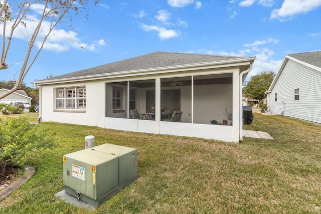 603 San Pedro Dr, The Villages, FL 32159 - rear view of house featuring a sunroom, a lawn, and a shingled roof