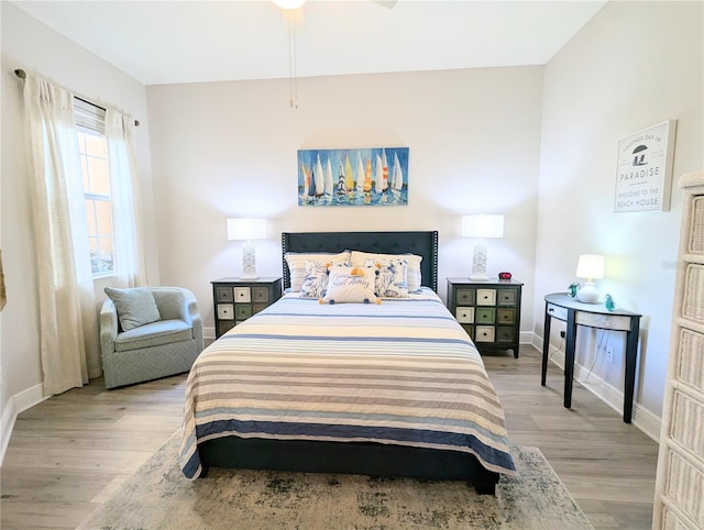 bedroom with ceiling fan and light wood-type flooring