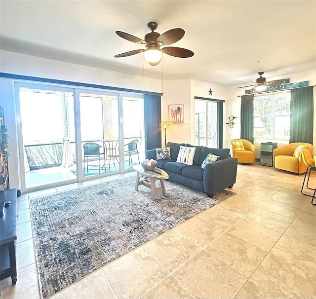 living area with ceiling fan