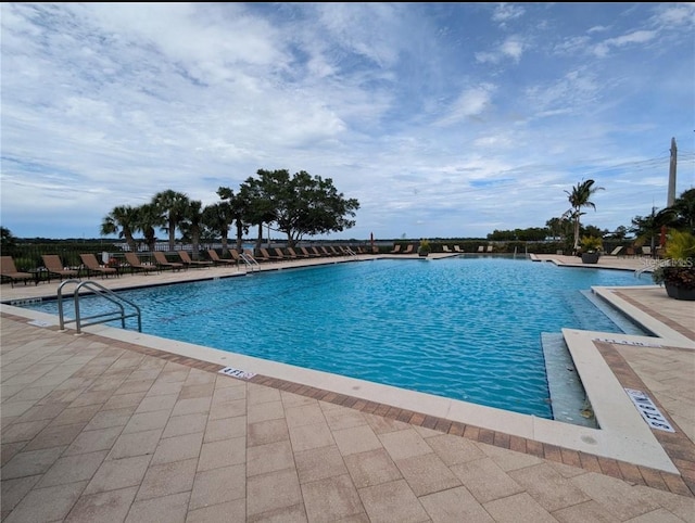 community pool with a patio area