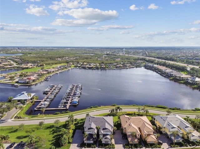 drone / aerial view featuring a residential view and a water view
