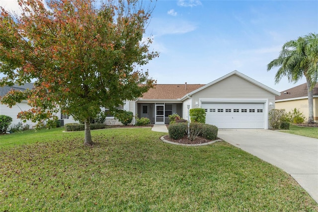 ranch-style house featuring a garage, driveway, and a front lawn