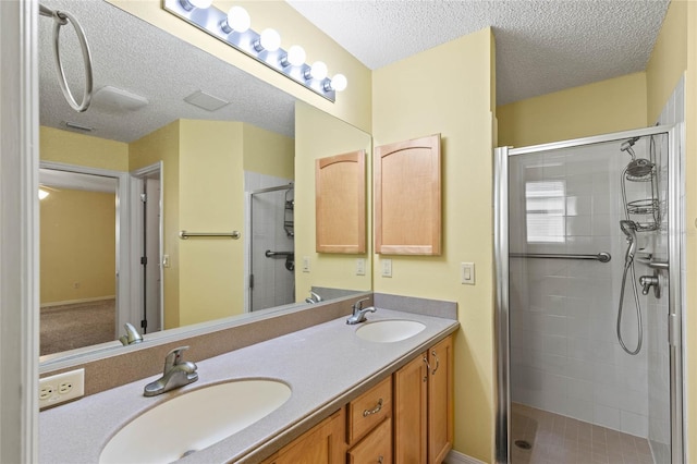 17848 SE 87th Bourne Ave, The Villages, FL 32162 - full bath with a stall shower, double vanity, and a textured ceiling
