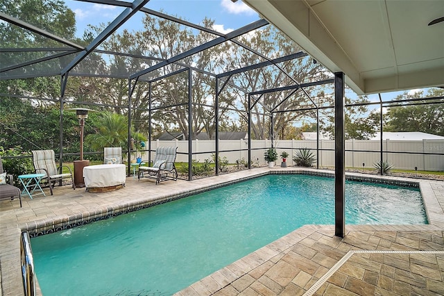 view of pool featuring a lanai and a patio