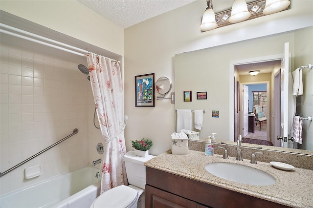 full bathroom with vanity, shower / tub combo, a textured ceiling, and toilet