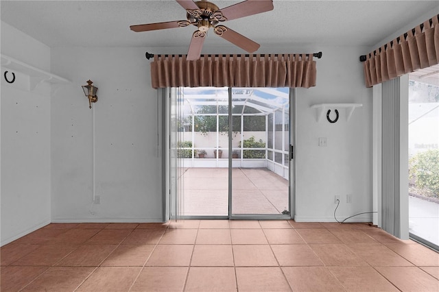 interior space with ceiling fan