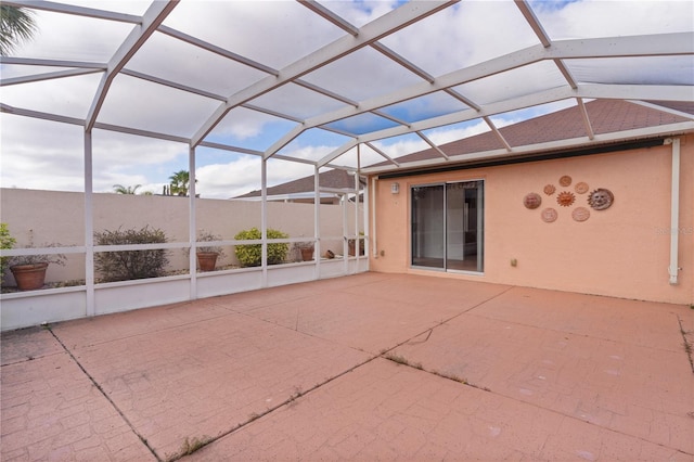 unfurnished sunroom with lofted ceiling