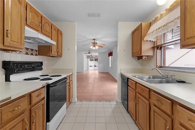 kitchen featuring dishwasher, sink, ceiling fan, light tile patterned floors, and white range with electric stovetop