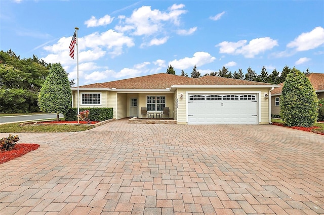 ranch-style home with a garage