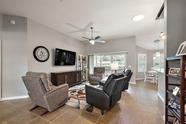 tiled living room featuring ceiling fan and vaulted ceiling