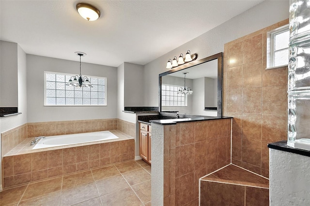 bathroom with an inviting chandelier and plenty of natural light