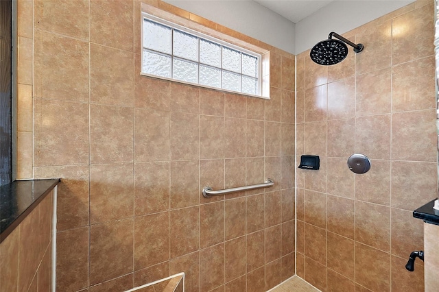 bathroom with tiled shower