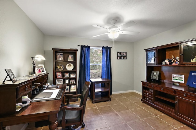 home office featuring tile patterned flooring and ceiling fan