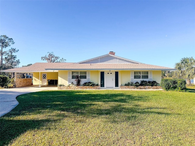 single story home with a carport and a front yard