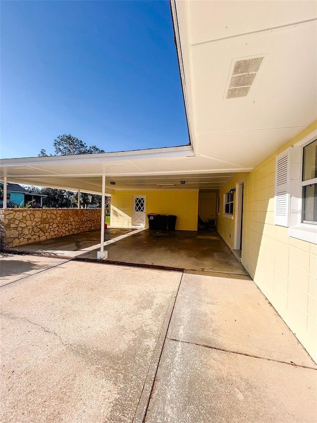 view of parking with a carport